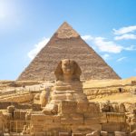 Front view of Sphinx and Khafre pyramid in the desert of Giza, Egypt
